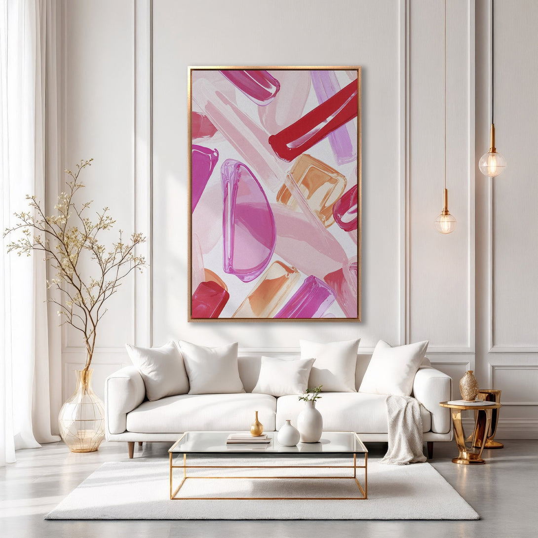 Framed Wall Art: Abstract brushstroke art in pink, red, and peach tones. Modern canvas print adds a pop of color to a bright, white interior.