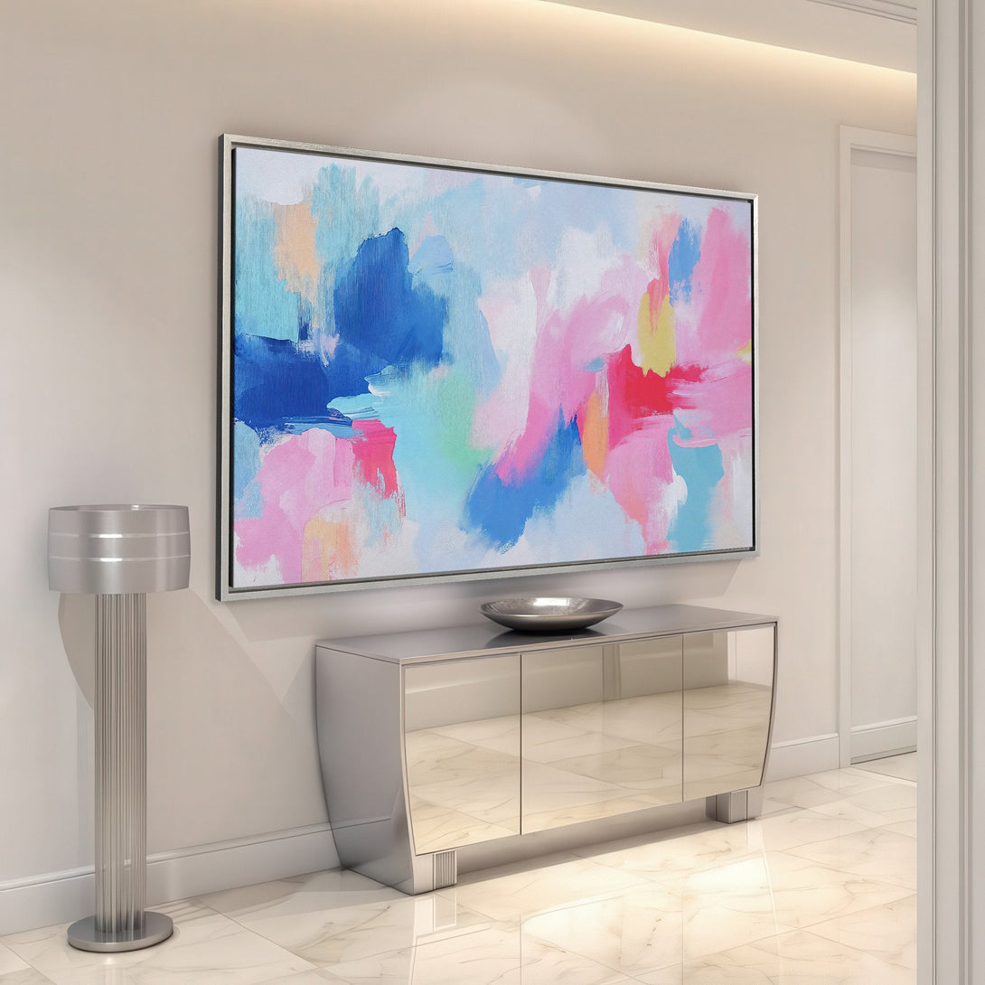 Framed Wall Art: Abstract art Canvas Print in modern interior. Colorful brushstrokes in pink, blue, and yellow brighten any space. Shop now!