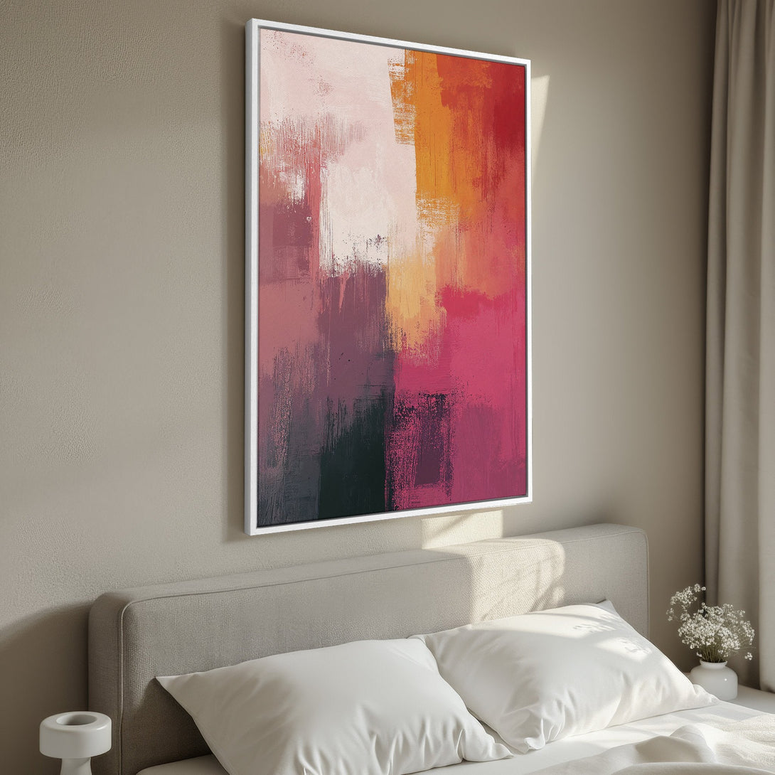 Framed Wall Art featuring abstract brushstrokes in warm pink, orange, and red hues. Modern canvas print perfect for bedroom decor, adding a pop of color & style.