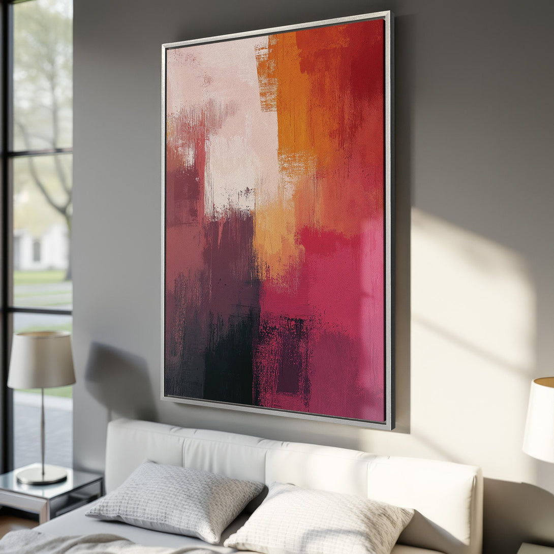 Framed Wall Art: Abstract canvas print with a vibrant, warm color palette of reds, oranges, and pinks. Perfect for adding a modern touch to any space.