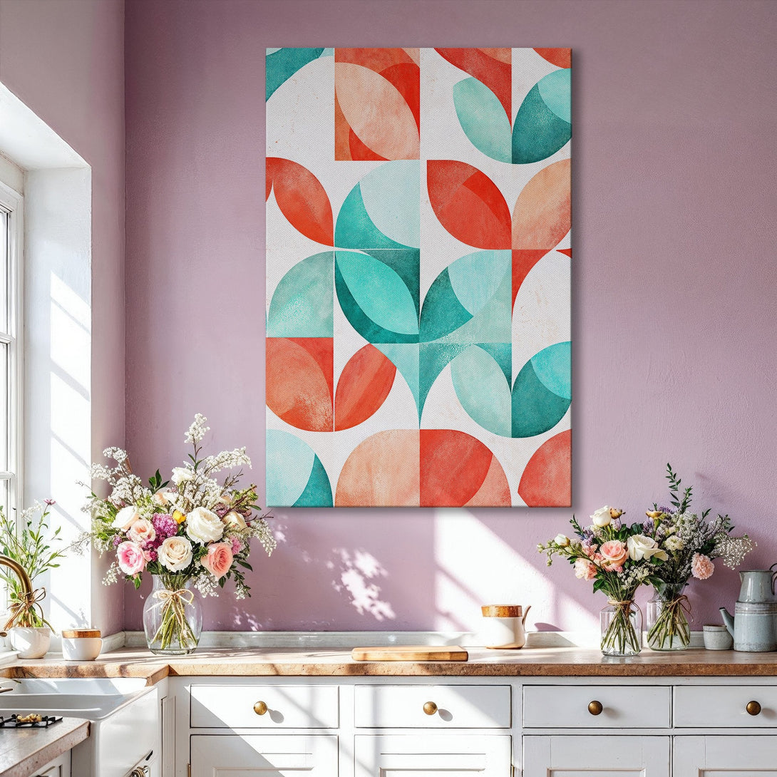 Framed Wall Art featuring a geometric abstract design in teal, coral, and beige. Modern art canvas print adds a pop of color to any living room.