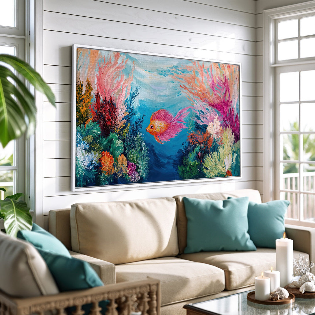 Framed Wall Art: Colorful coral reef painting with a vibrant fish. Coastal-inspired decor in a living room. Featuring a bright, inviting color palette.