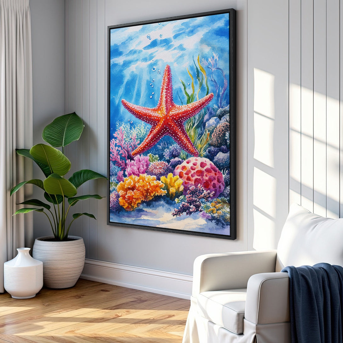Framed Wall Art featuring a vibrant watercolor starfish and coral reef scene. Blue, red, and orange hues create a stunning coastal aesthetic.