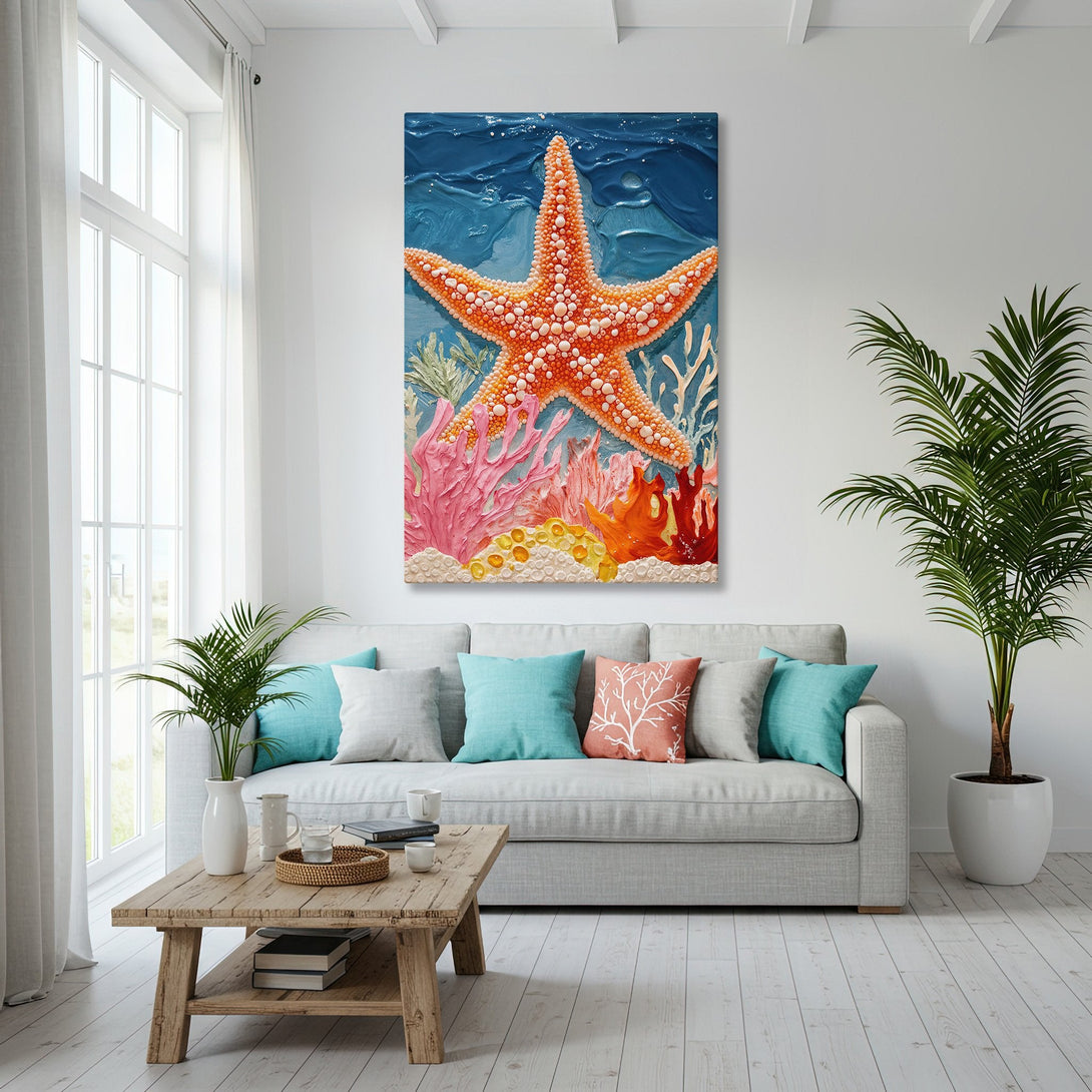 Framed Wall Art featuring a vibrant starfish and coral reef scene. Coastal style with a warm orange, pink, and blue color palette. Perfect beach house decor.