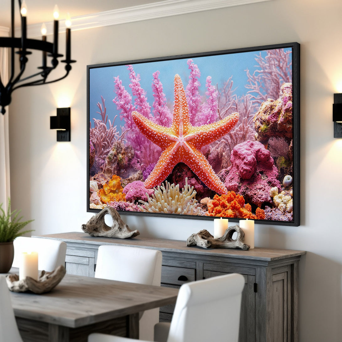 Framed Wall Art featuring a vibrant starfish in an underwater scene with pink and orange coral. Coastal decor canvas print to brighten any room.
