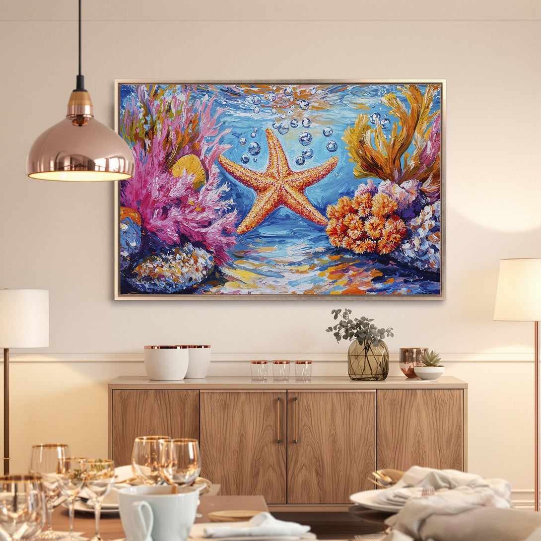 Framed Wall Art: Vibrant starfish painting with coral reef in blue, pink, and orange. Add coastal charm to your home with this stunning canvas print.