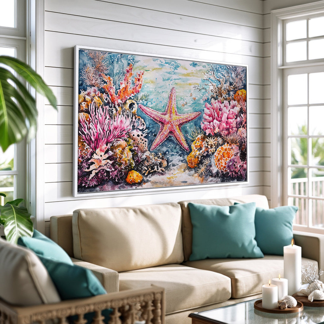 Framed Wall Art of a vibrant watercolor starfish and coral reef. Coastal style art with pinks, blues, and oranges. Perfect for beach house decor.