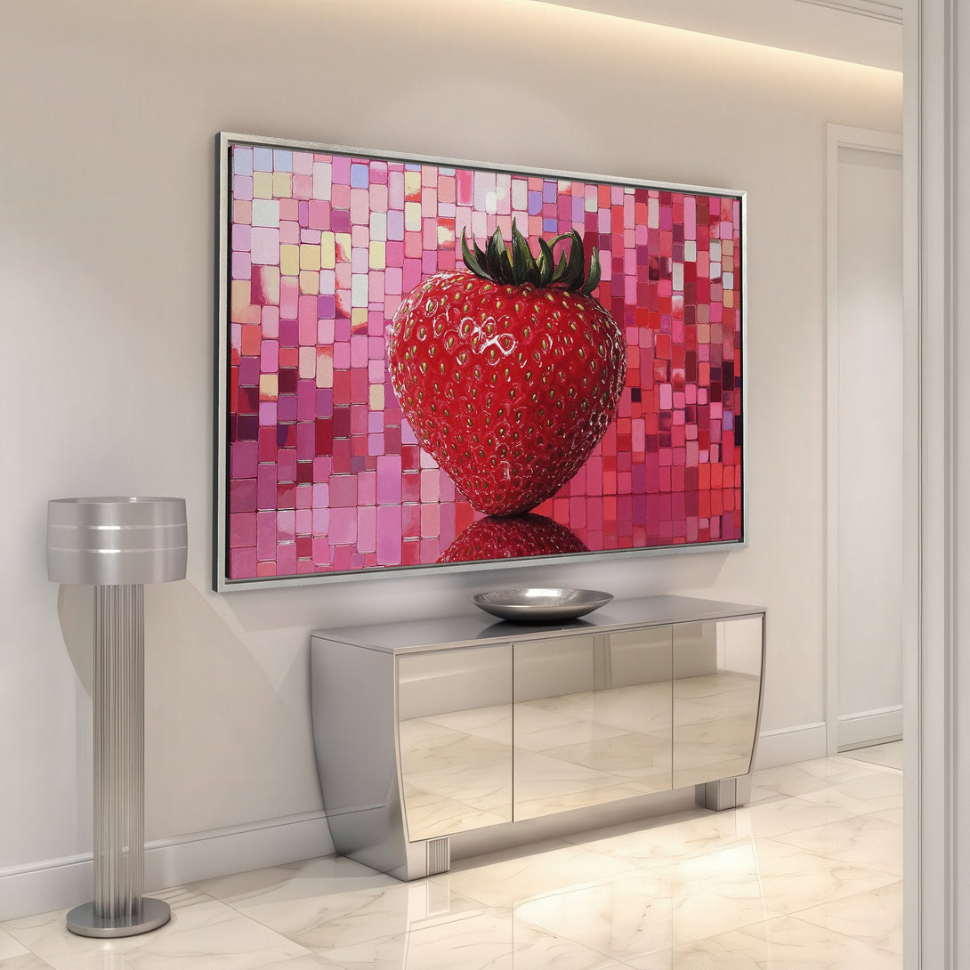 Framed wall art featuring a vibrant strawberry against a pink mosaic background. Modern style, perfect for adding a pop of color to any space.