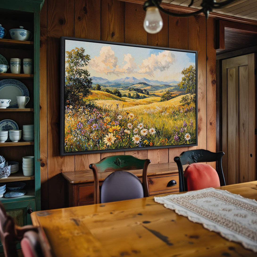 Framed Wall Art: Landscape Canvas Print with wildflowers, green and yellow hues, displayed in a rustic interior. Bring the outdoors in!