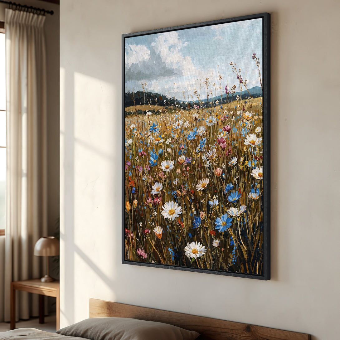 Framed Wall Art featuring a vibrant wildflower meadow painting in warm earth tones with pops of blue and white, perfect for adding a touch of nature to your home.