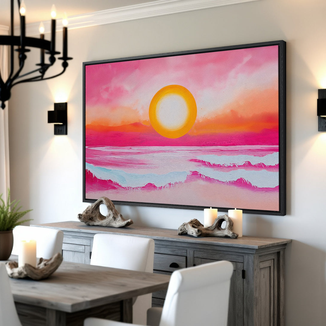 Framed Wall Art: Abstract sunset over ocean in pink, orange, and yellow. Modern canvas print adds vibrant color to dining room decor.