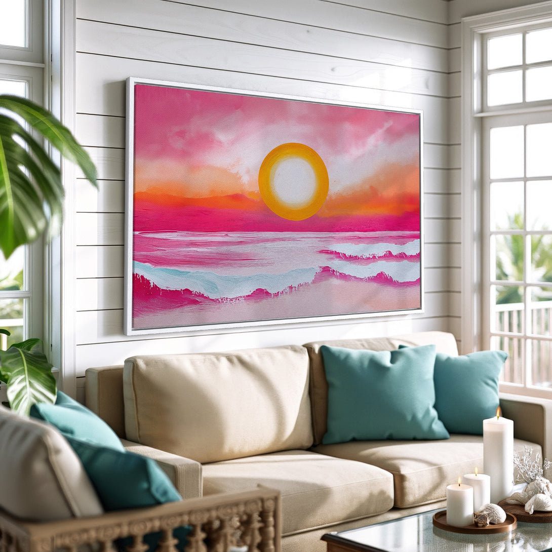 Framed Wall Art: Abstract sunset over ocean in pink, orange, and blue hues. Coastal style canvas print adds vibrant color to living room decor.