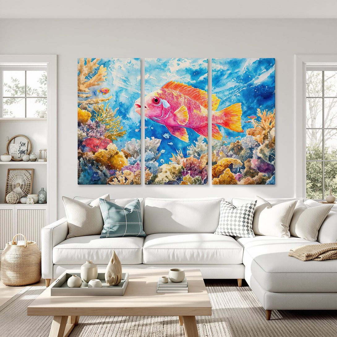Canvas Print of a vibrant watercolor fish and coral reef scene in blue, pink, and yellow. Perfect coastal wall art for your home!