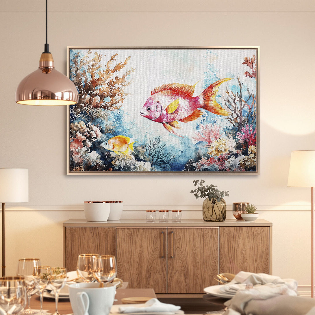 Framed Wall Art: Watercolor fish painting in a coastal style. Features vibrant coral, red, and blue hues. Perfect for adding a splash of color to your home!