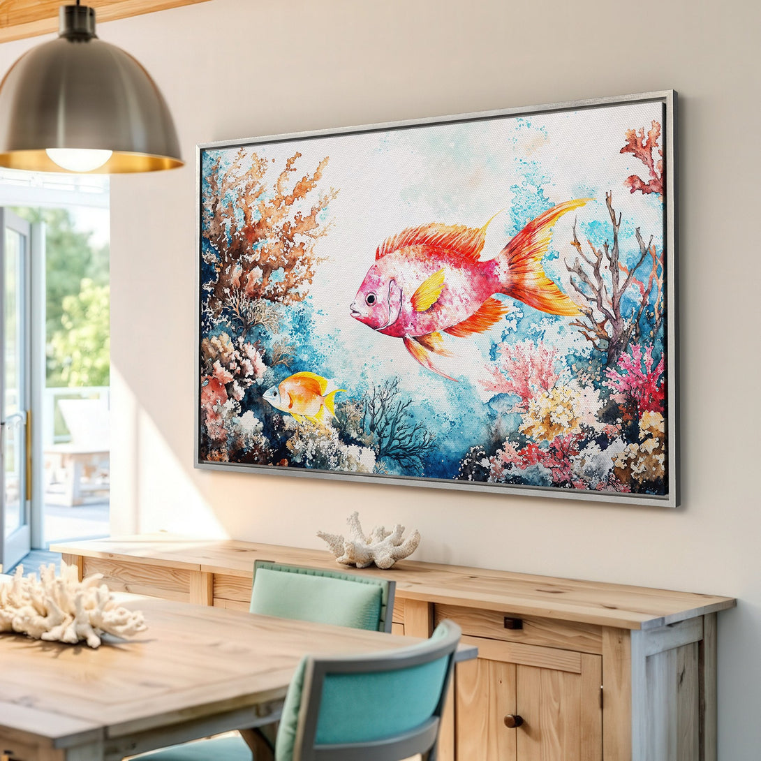Framed Wall Art: Watercolor fish and coral reef art in a vibrant red, orange, and blue palette. Coastal style canvas print for a calming interior.