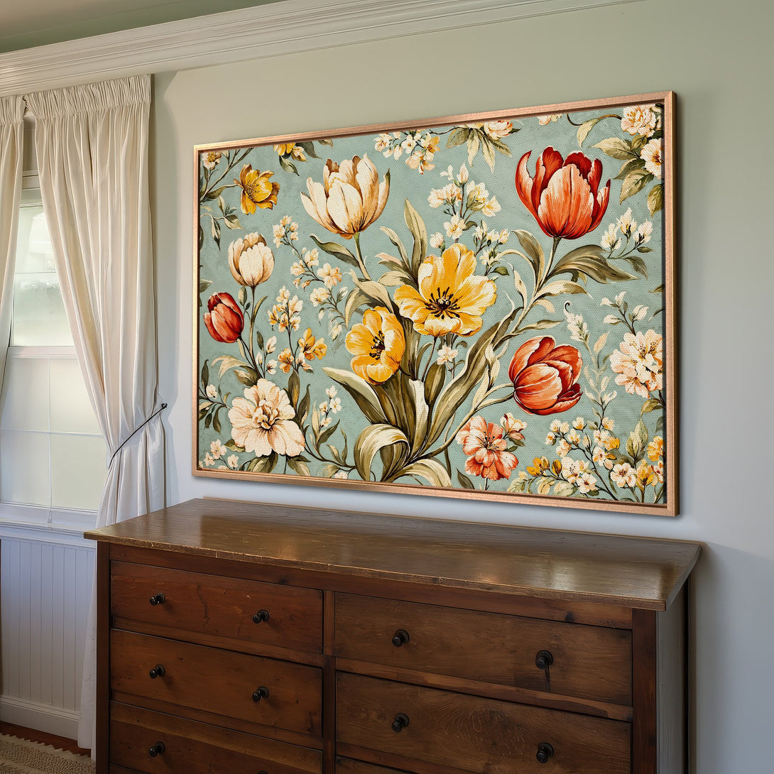 Framed Wall Art featuring a vintage floral design with yellow, orange, and cream blooms on a teal background. Perfect for adding a touch of elegance.