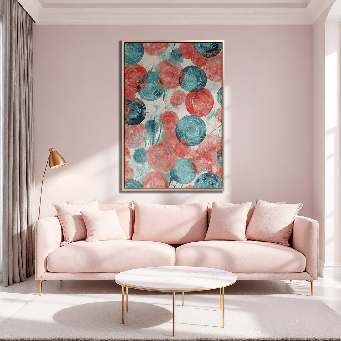 Framed Wall Art featuring abstract circles in teal and coral. Modern Canvas Print adds a pop of color to a blush pink living room.