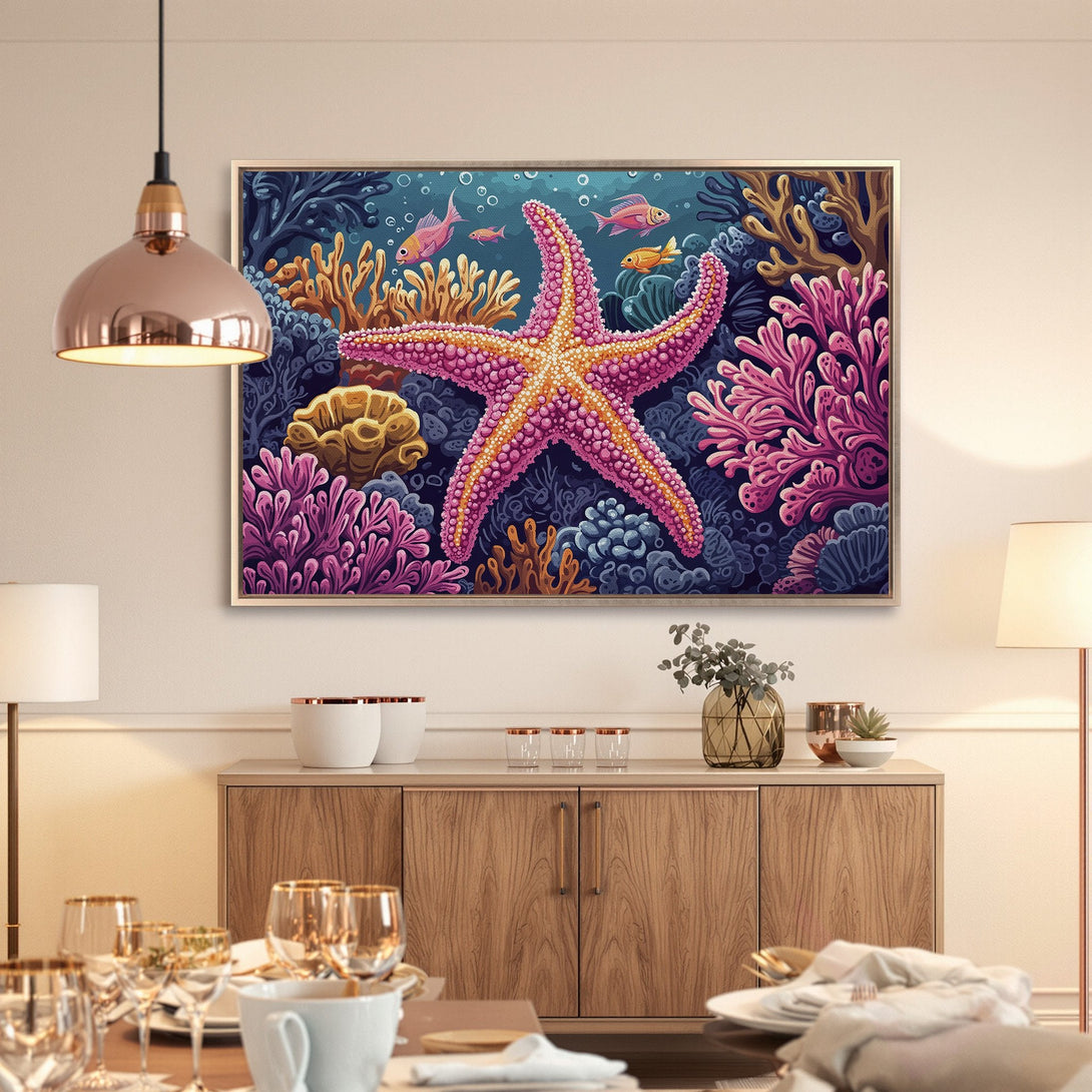 Framed Wall Art featuring a vibrant starfish and coral reef scene. Colorful canvas print with pink, blue, and gold hues. Perfect ocean-themed decor.