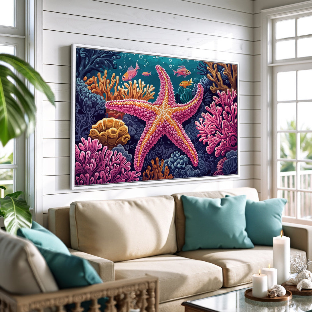 Framed Wall Art featuring a vibrant starfish and coral reef scene, perfect for coastal decor. Bright pinks, blues, and oranges pop against a dark background.