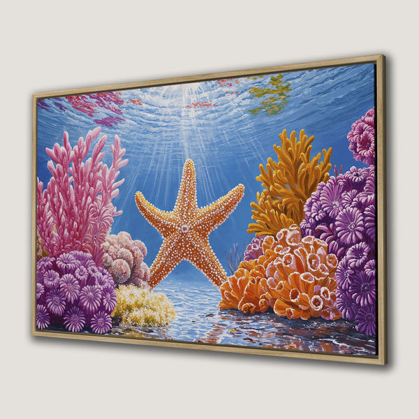 Framed Wall Art featuring a vibrant underwater scene. Starfish and coral in a colorful palette of blues, oranges, and pinks. Perfect for coastal decor!