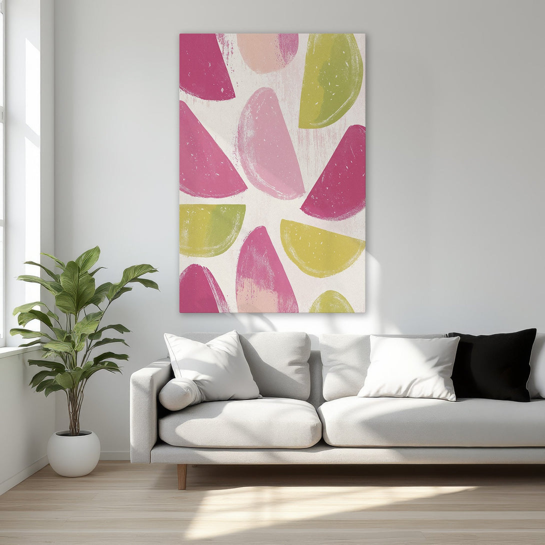 Framed Wall Art featuring abstract fruit slices in pink and green hues. Modern canvas print adds a pop of color to any interior.