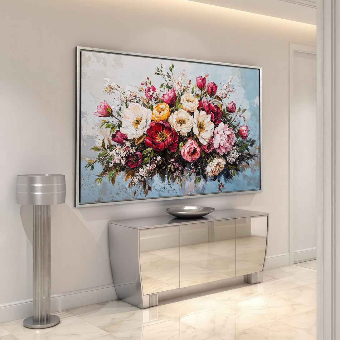 Framed Wall Art: Floral painting with vibrant red, pink, and yellow blooms. Modern style, set against a light blue backdrop. Perfect for home decor.