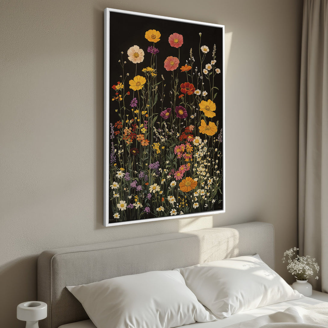 Framed Wall Art featuring vibrant wildflower painting with a black background. Adds a pop of color with yellow, pink, and orange hues to any room.