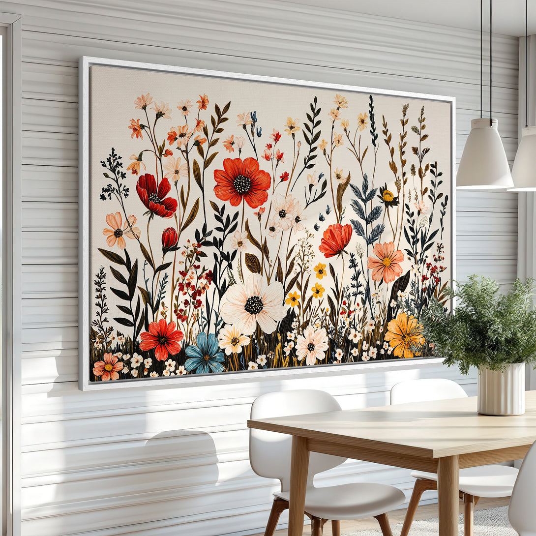Framed Wall Art featuring a vibrant floral design in a farmhouse style. The artwork showcases a colorful palette of red, orange, and blue blooms.