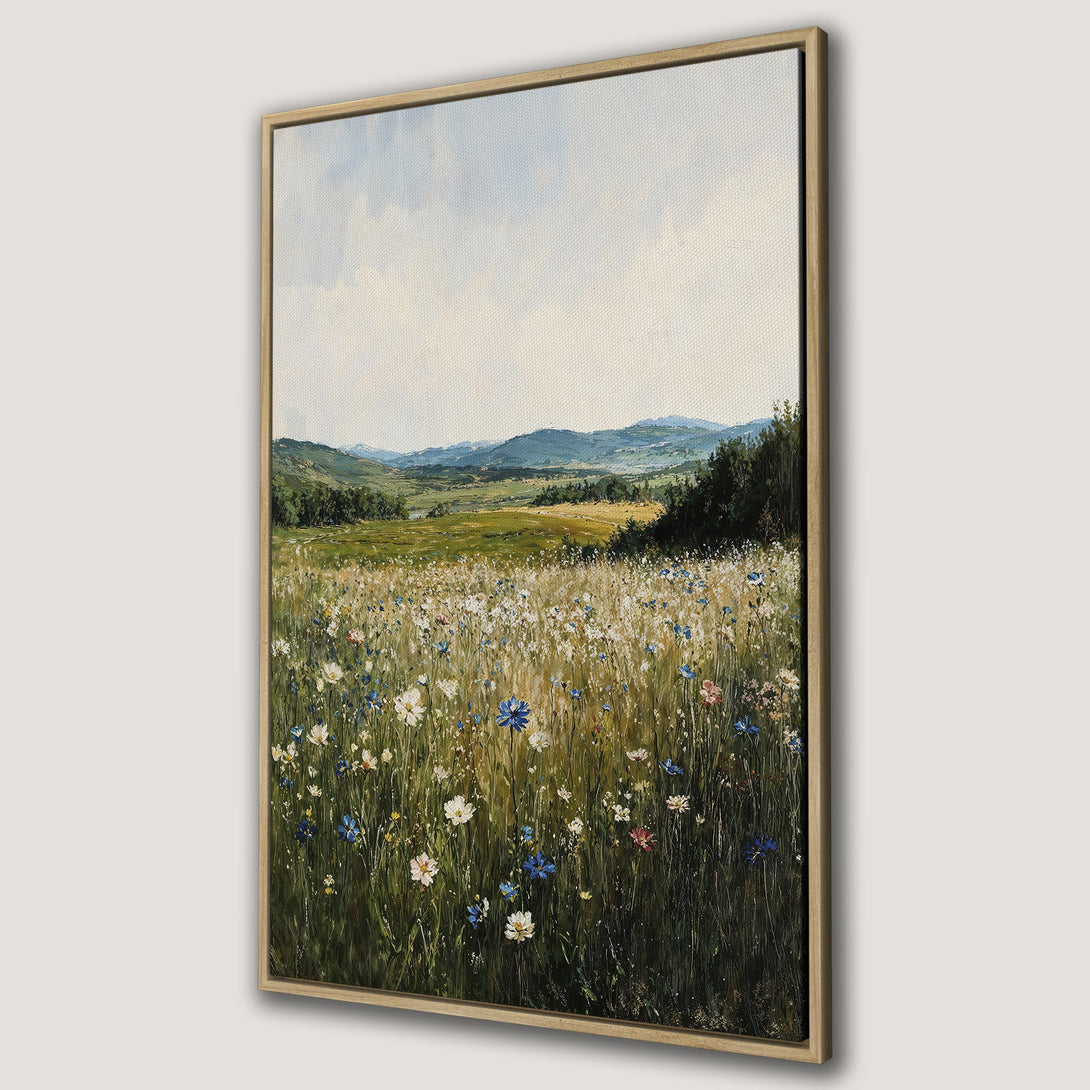Framed Wall Art of a wildflower meadow landscape in a painterly style. Featuring a natural color palette of greens, blues, and yellows. Perfect for home decor.