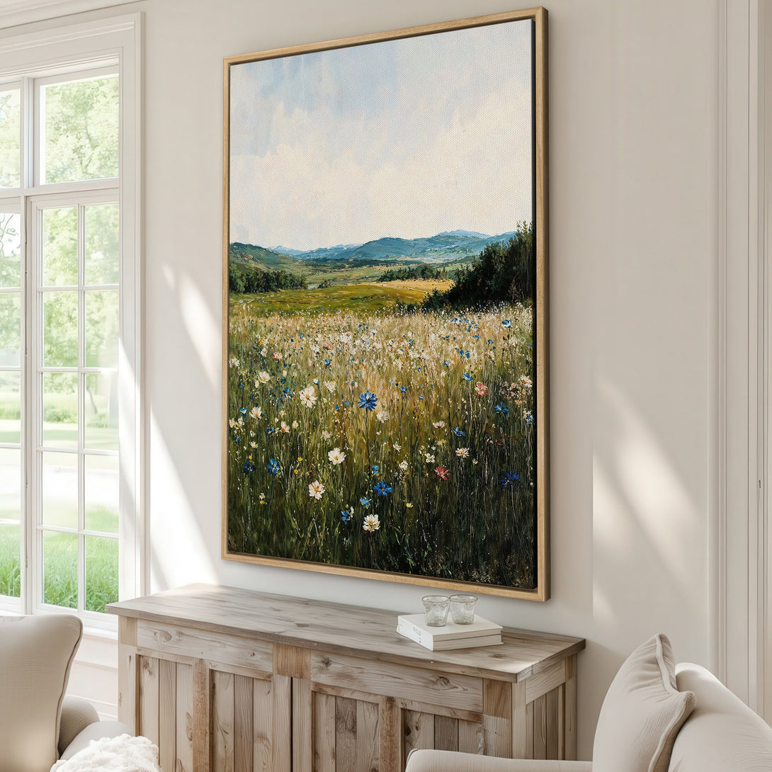 Framed Wall Art featuring a serene landscape painting with wildflowers. Soft, impressionistic style with a calming palette of greens, blues, and yellows. Perfect for adding a touch of nature.