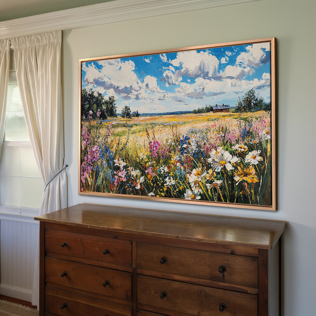 Framed Wall Art of a vibrant wildflower field painting with blue sky and clouds. Rustic style, colorful palette.