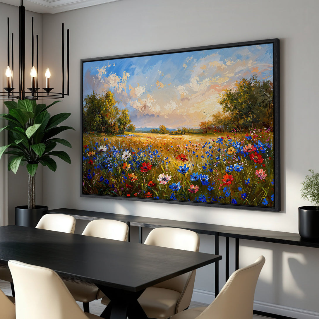 Framed Wall Art featuring a vibrant wildflower field painting in a dining room. Impressionistic style with a colorful palette of blues, reds, and yellows.
