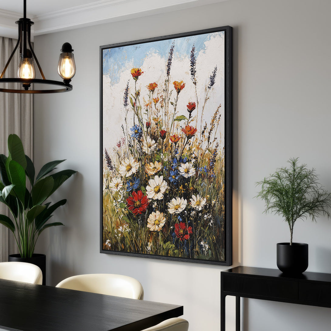 Framed Wall Art featuring a vibrant floral painting. Impressionistic style with a warm color palette of red, orange, white, and blue. Perfect for adding art to your home.