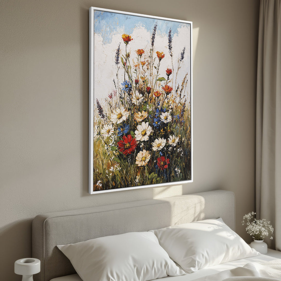 Framed Wall Art: Colorful wildflower painting in a bedroom. Impressionistic style with warm, earthy tones and pops of red, blue, and white.