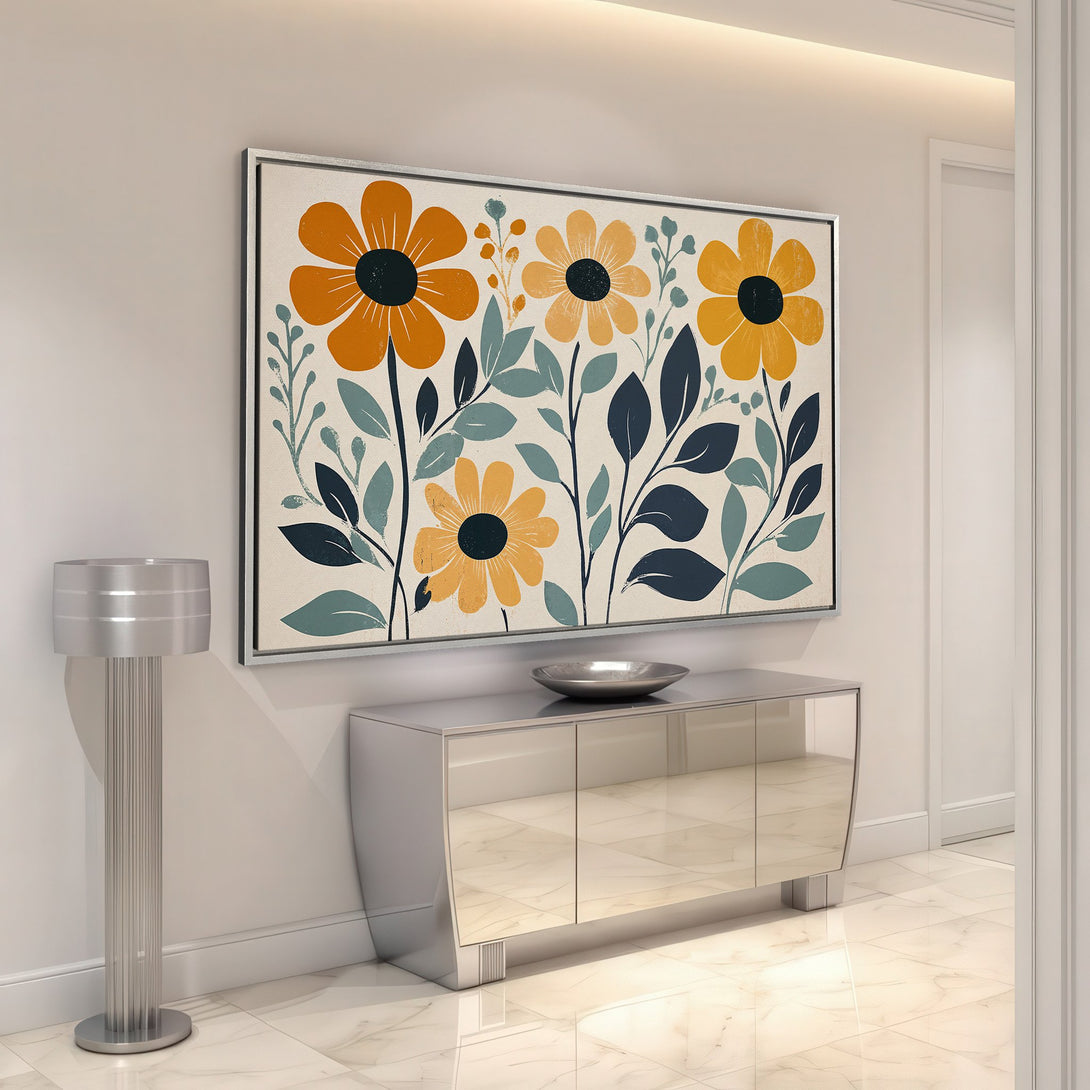 Framed Wall Art featuring a modern floral design in orange, yellow, and blue, displayed in a stylish interior setting. Perfect for adding a pop of color!