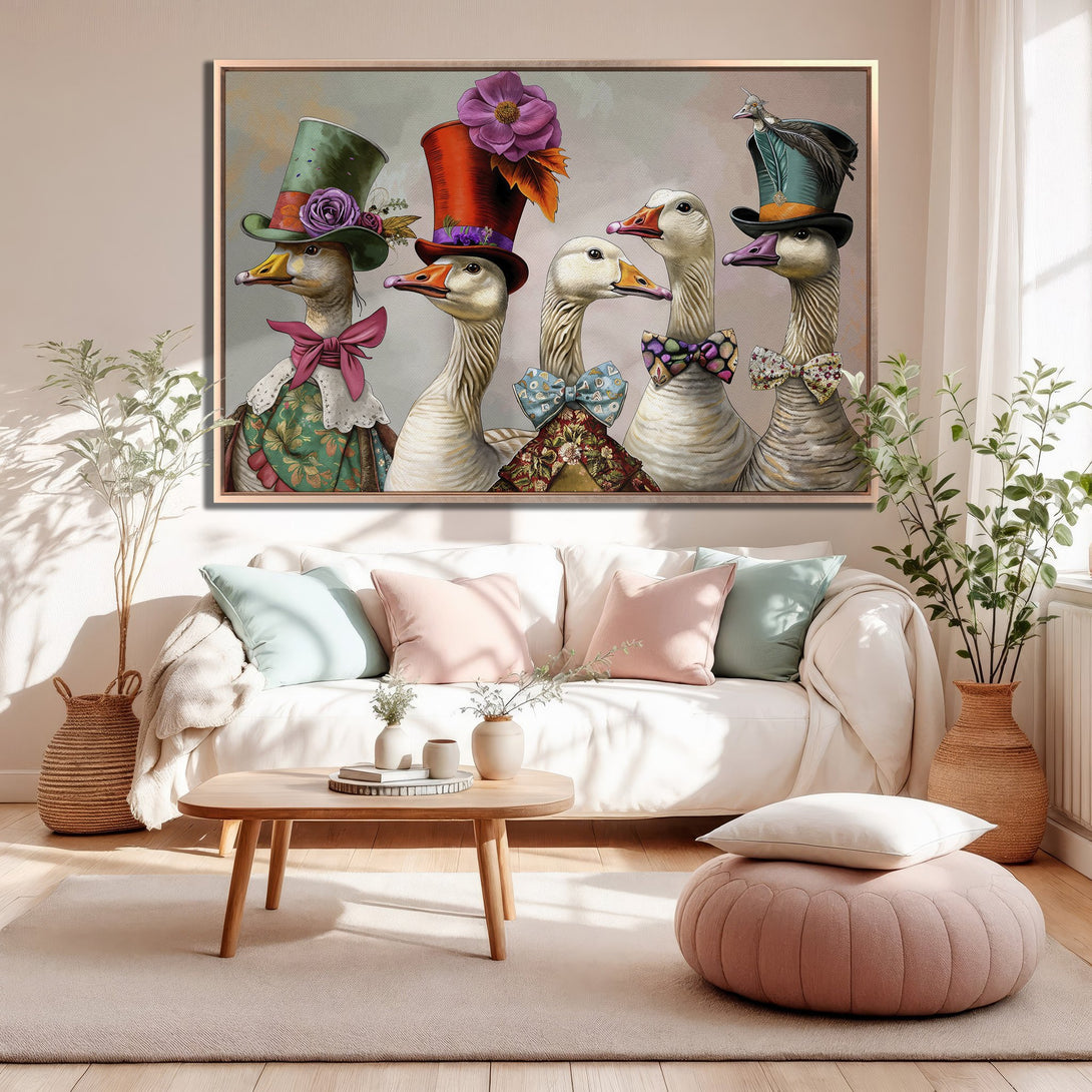 Framed Wall Art featuring whimsical geese in hats. Charming artwork with a soft, pastel color palette, perfect for adding character to your home decor.