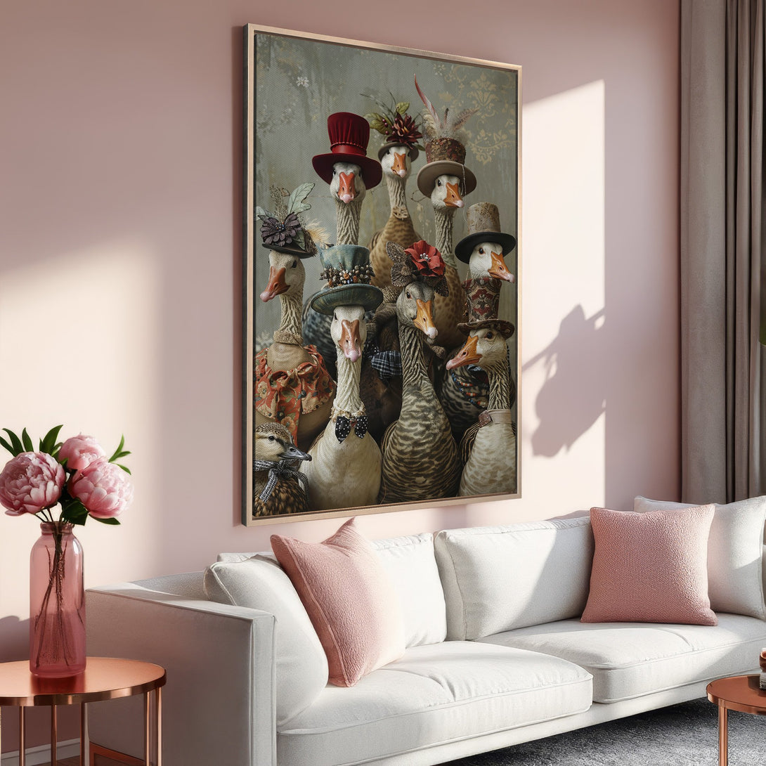 Framed Wall Art featuring whimsical geese in hats, displayed in a stylish interior with a soft pink and neutral color palette, perfect for home decor.