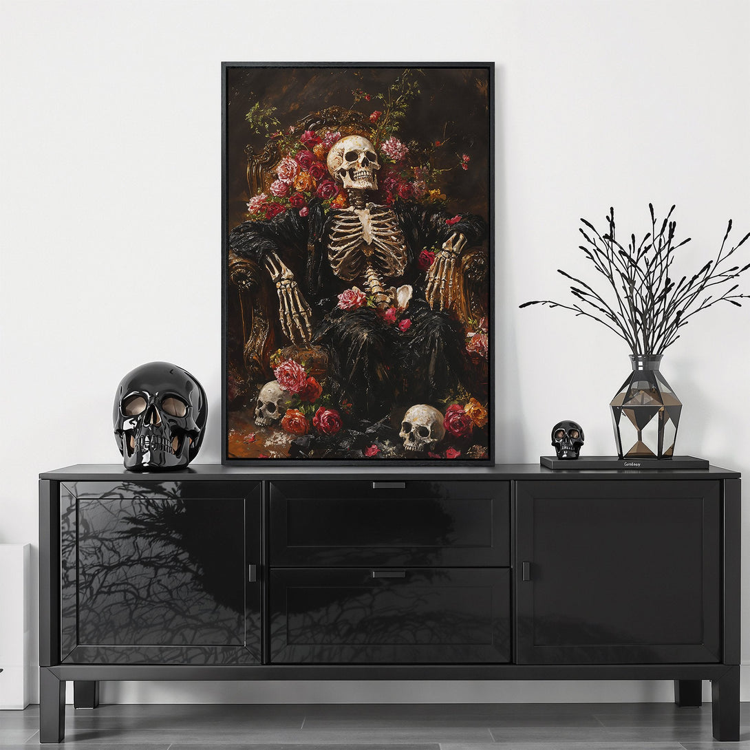 Framed Wall Art featuring a skeleton in a chair surrounded by flowers, dark and moody style with a rich color palette of reds, browns, and blacks.