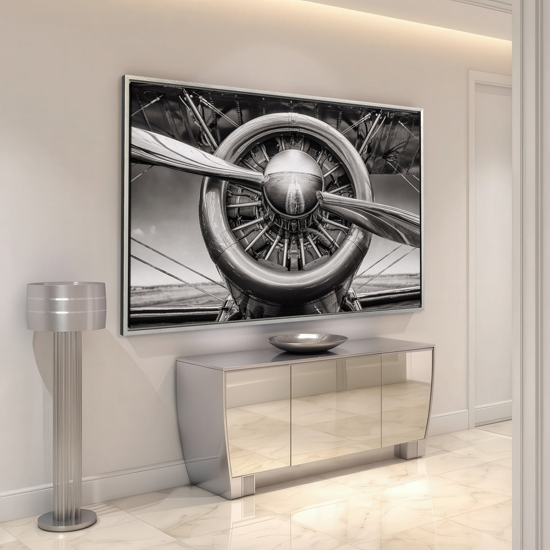 Framed Wall Art of vintage airplane propeller in a modern interior. Black and white photography canvas print for a stylish home.