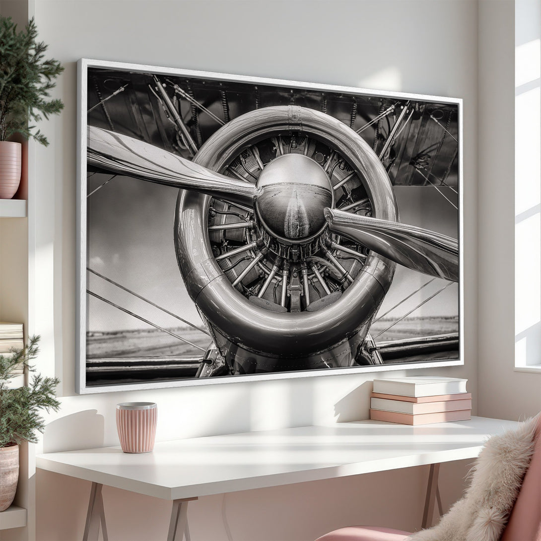 Framed Wall Art: Vintage airplane propeller in monochrome. Industrial style canvas print adds a bold statement to any space. Black and white art for a modern look.
