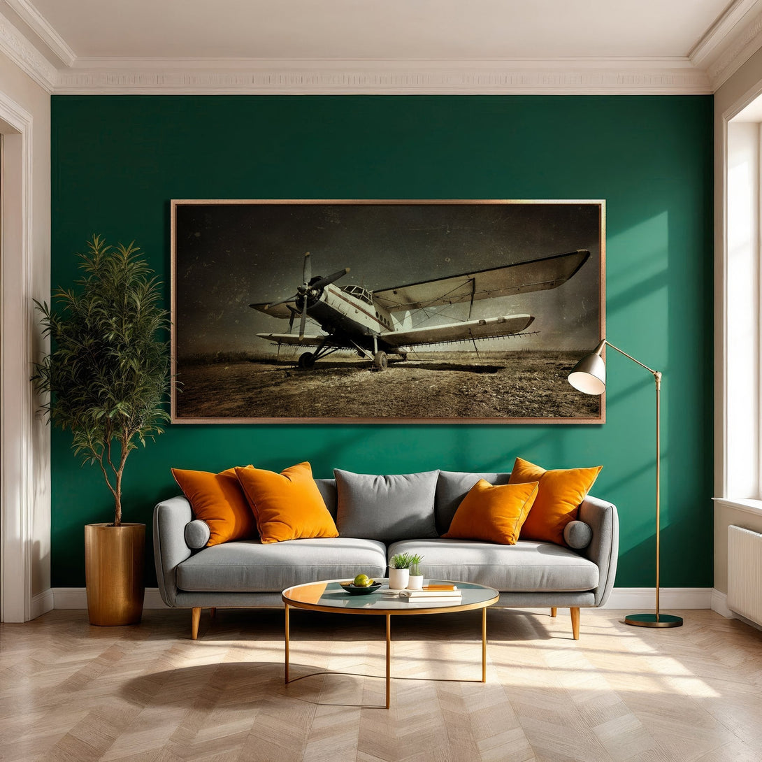 Framed Wall Art of vintage airplane in sepia tones, displayed in a stylish living room. Earthy palette with pops of orange. Perfect home decor accent.