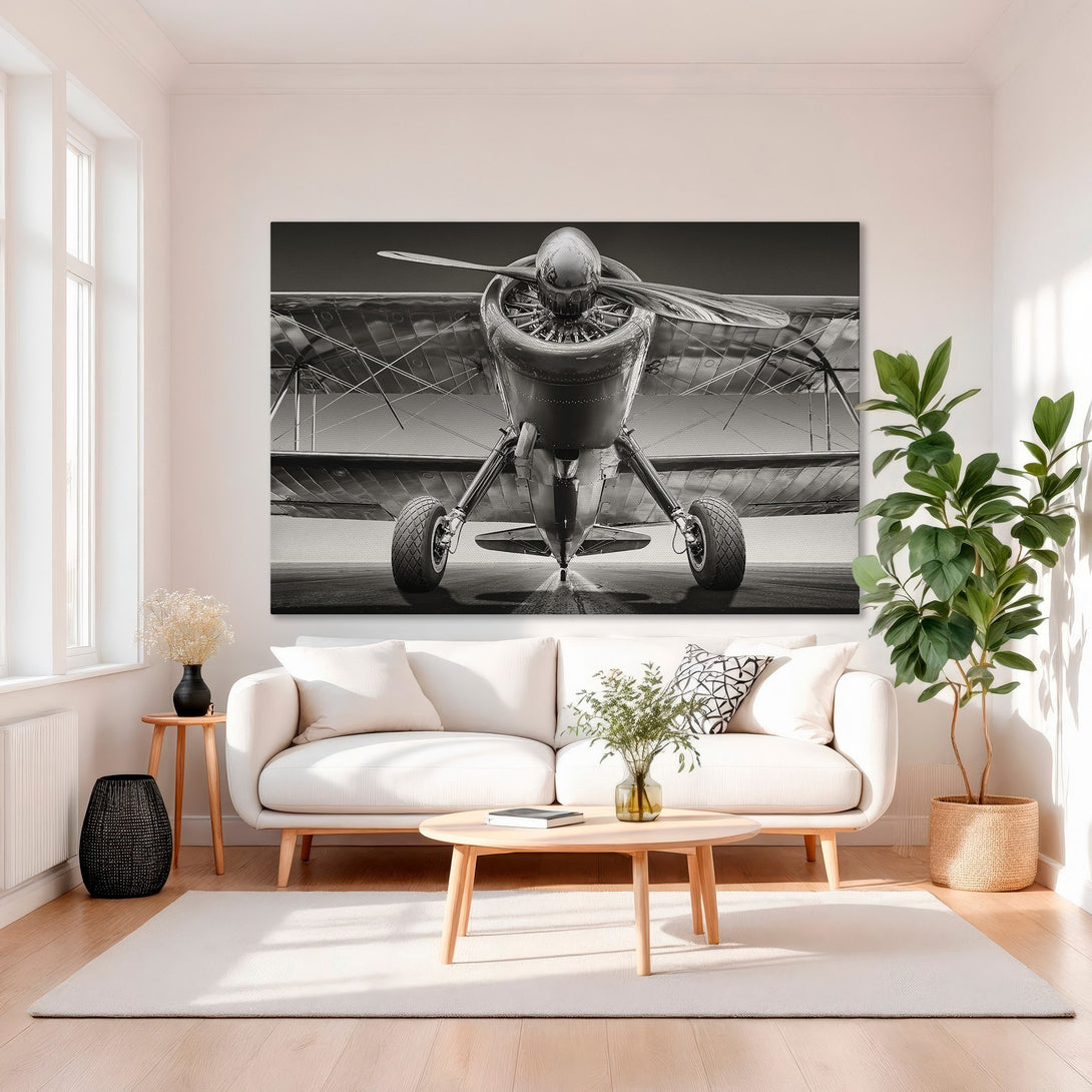 Framed Wall Art: Vintage airplane canvas print in monochrome. Classic style, neutral tones, and gold frame create a sophisticated aesthetic for any living space.