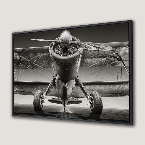 Framed Wall Art: Vintage airplane canvas print in monochrome tones. Perfect aviation decor for your home or office. Add a touch of history to any space!