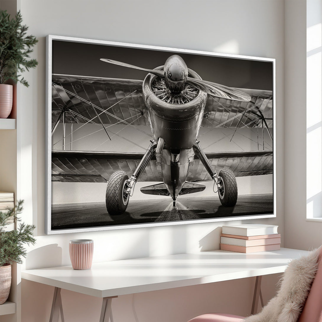 Framed Wall Art: Vintage biplane in monochrome. Elevate your space with this stunning Canvas Print featuring a classic aircraft, perfect for aviation enthusiasts.
