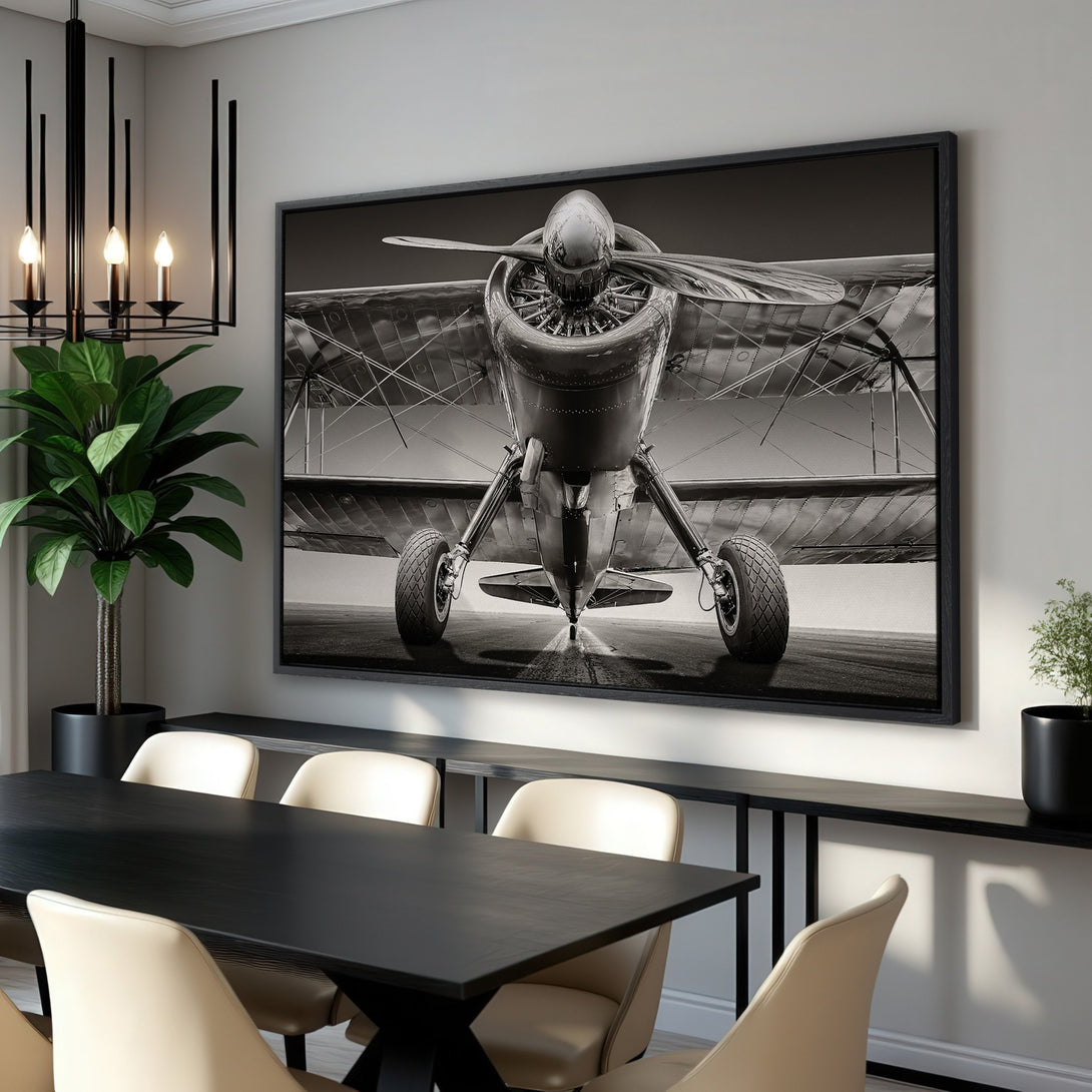 Framed Wall Art: Stunning black and white canvas print of a vintage airplane. Perfect aviation art for your home decor. Classic style, neutral color palette.