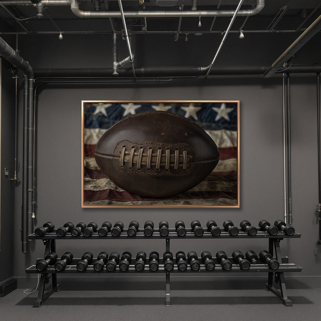 Framed Wall Art: Vintage football on American flag canvas print. Rustic style, neutral color palette. Perfect for gym or man cave decor.