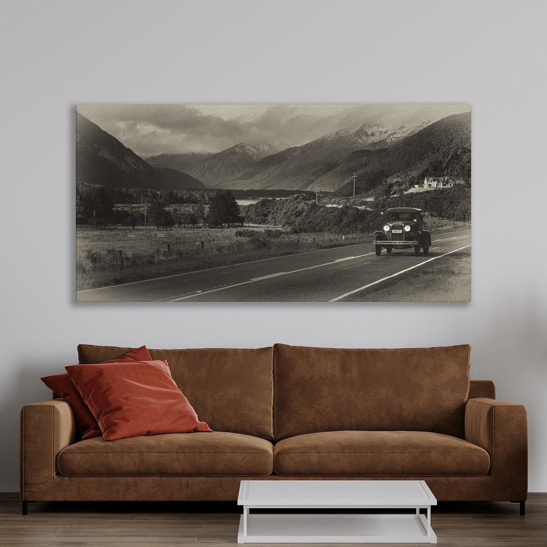 Framed Wall Art of a vintage car on a scenic road in black and white, perfect for adding a touch of classic style to your home decor.