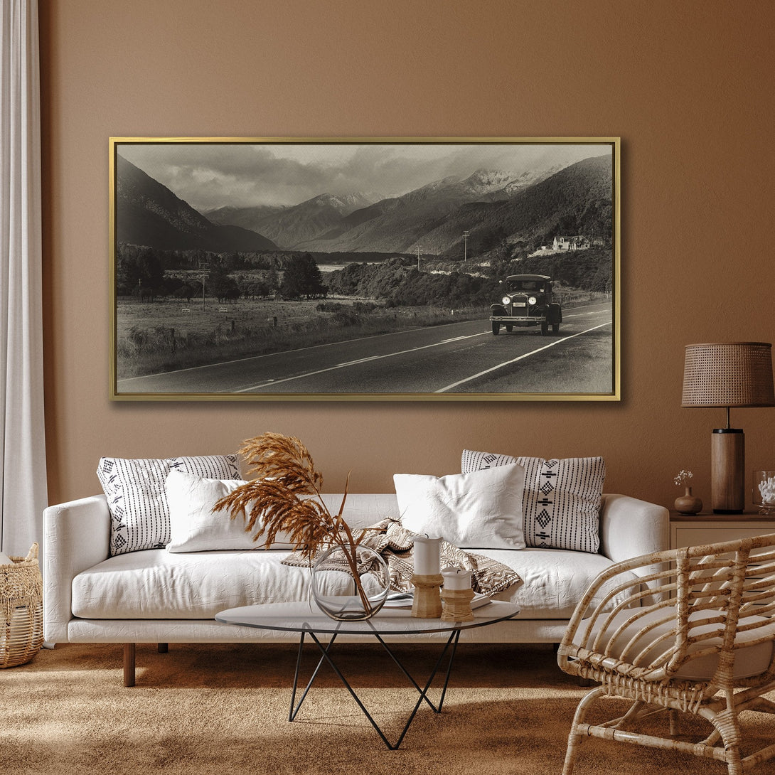 Canvas Print of a vintage car on a scenic road, sepia tones. Rustic wall art perfect for adding a touch of nostalgia to your home decor.
