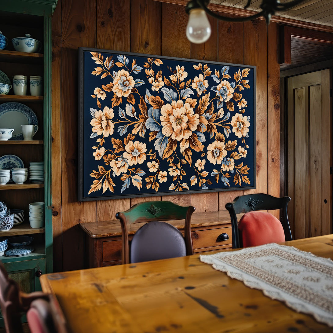 Framed Wall Art: Floral canvas print in a rustic interior. Features a navy background with peach and blue flowers. Perfect for farmhouse decor.