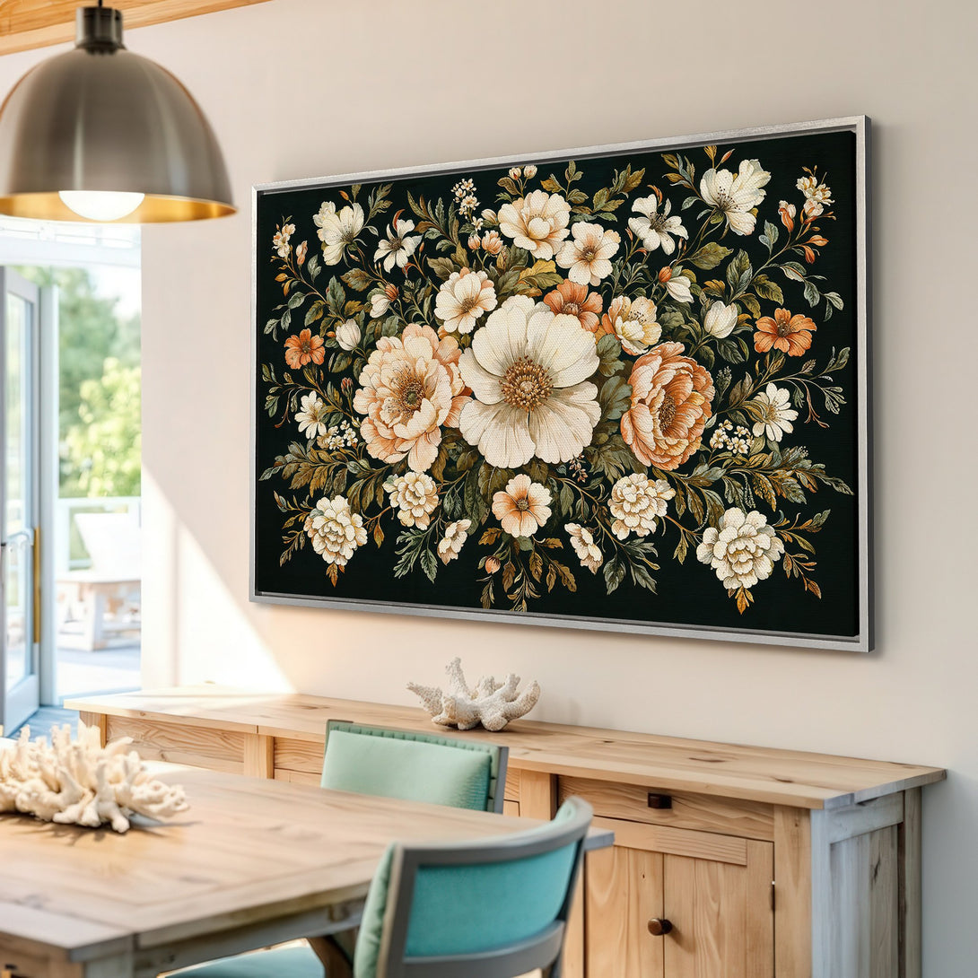 Framed Wall Art: Floral canvas print with a dark background, featuring cream, peach, and green tones. Perfect for adding a touch of elegance.